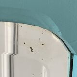 Beveled mirror on turquoise Parisian door