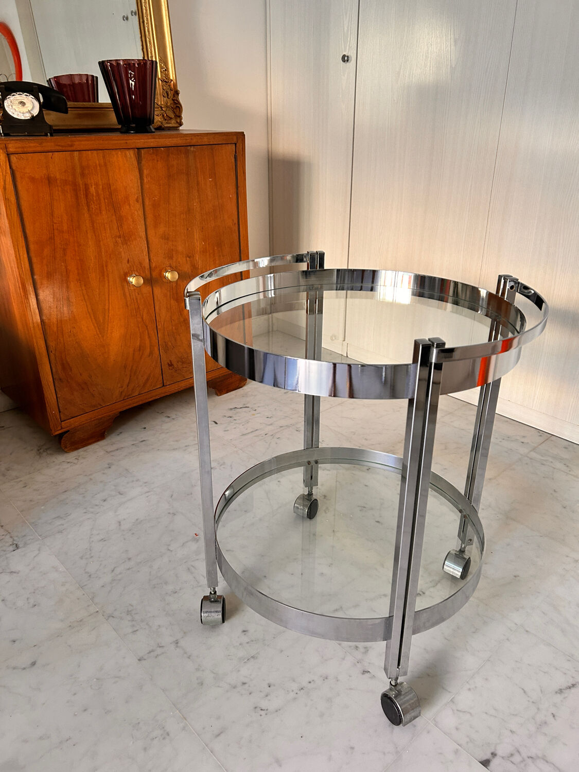 Vintage round dessert trolley in chrome steel, with two glass shelves.