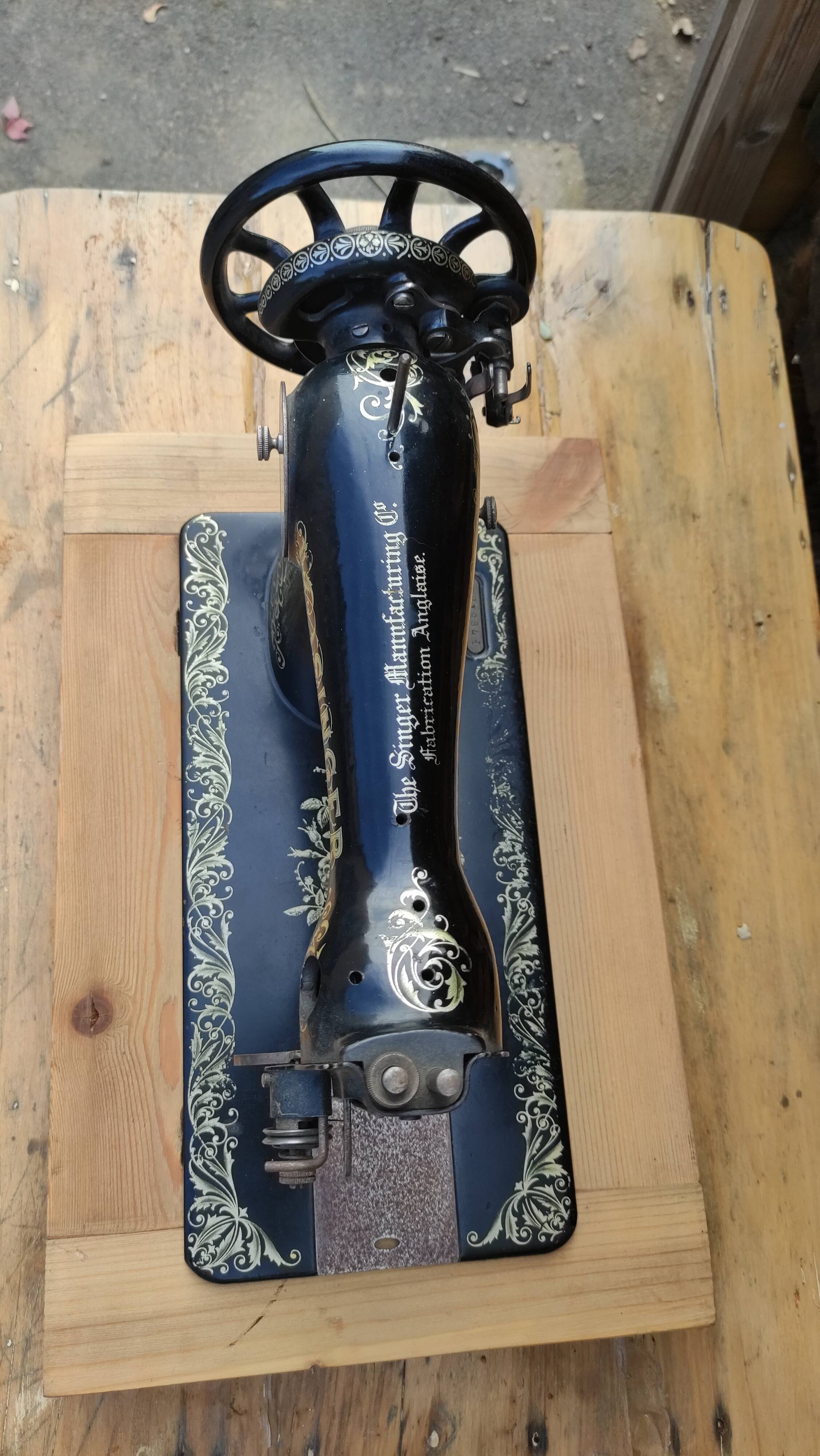 Old Singer sewing machine on pedestal