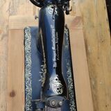 Old Singer sewing machine on pedestal