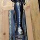 Old Singer sewing machine on pedestal