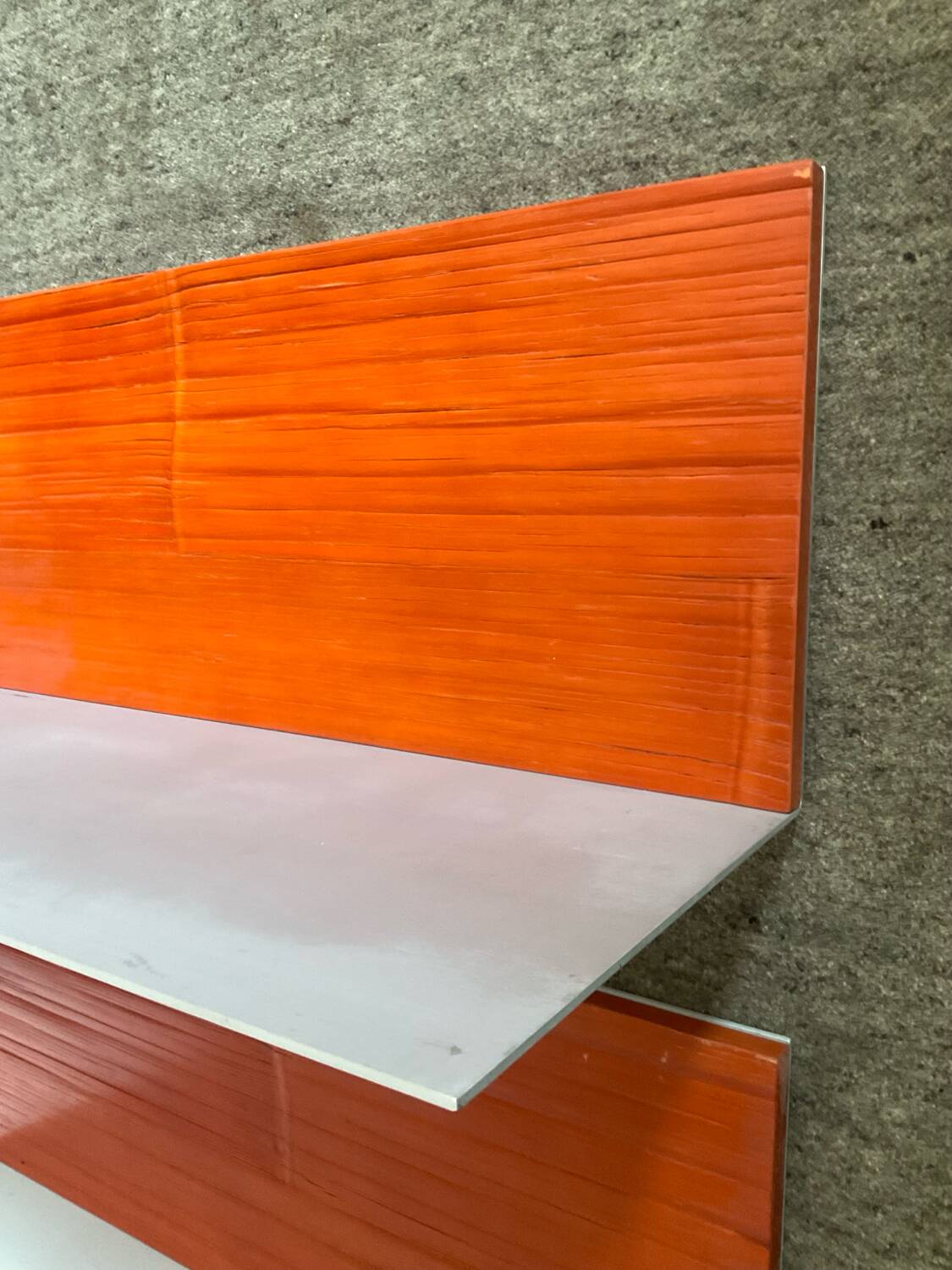 Pair of contemporary wall shelves in steel and stained wood