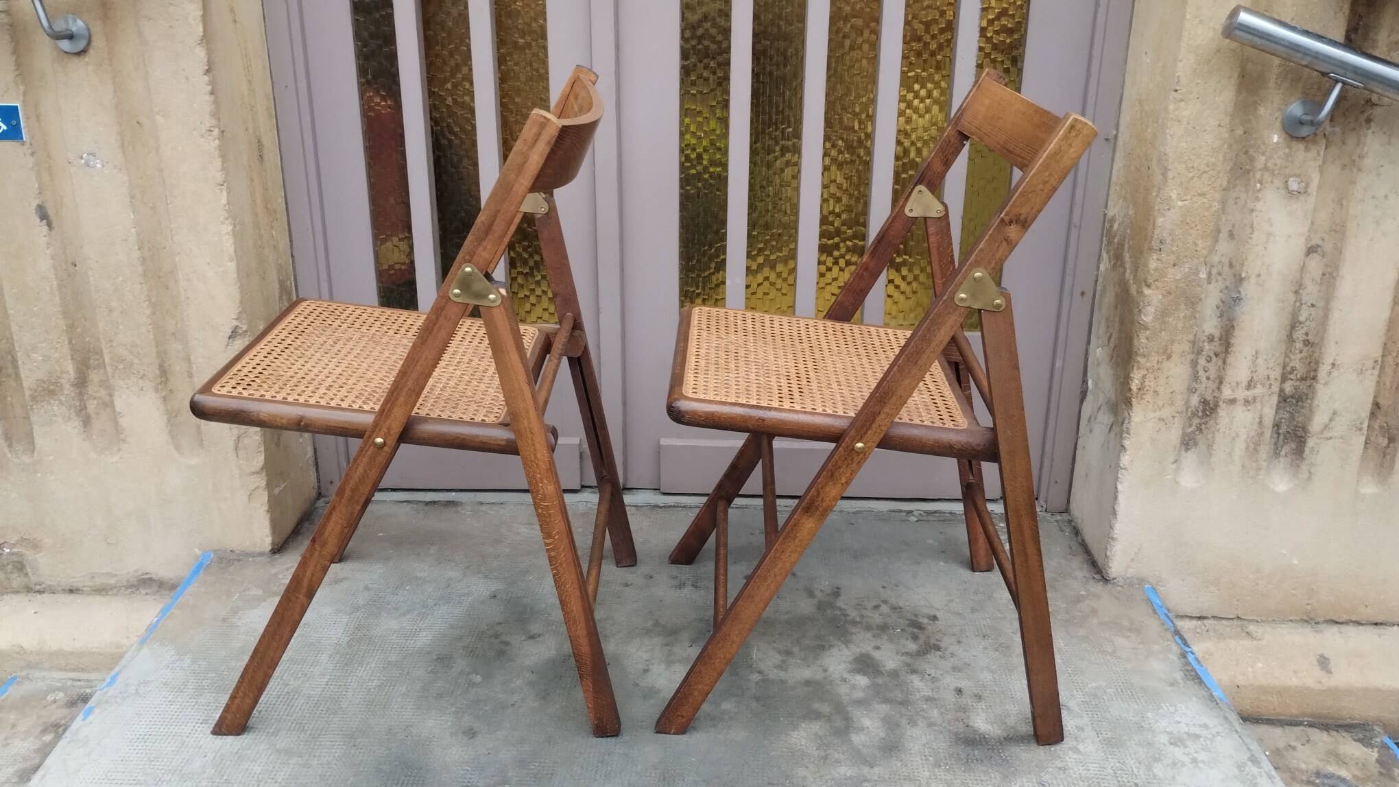 Pair of vintage wooden and cane folding chairs