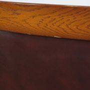 Very comfortable classic cowhide armchair with a high back in a mild Art Deco style