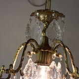 Old brass chandelier with glass stamps
