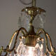 Old brass chandelier with glass stamps