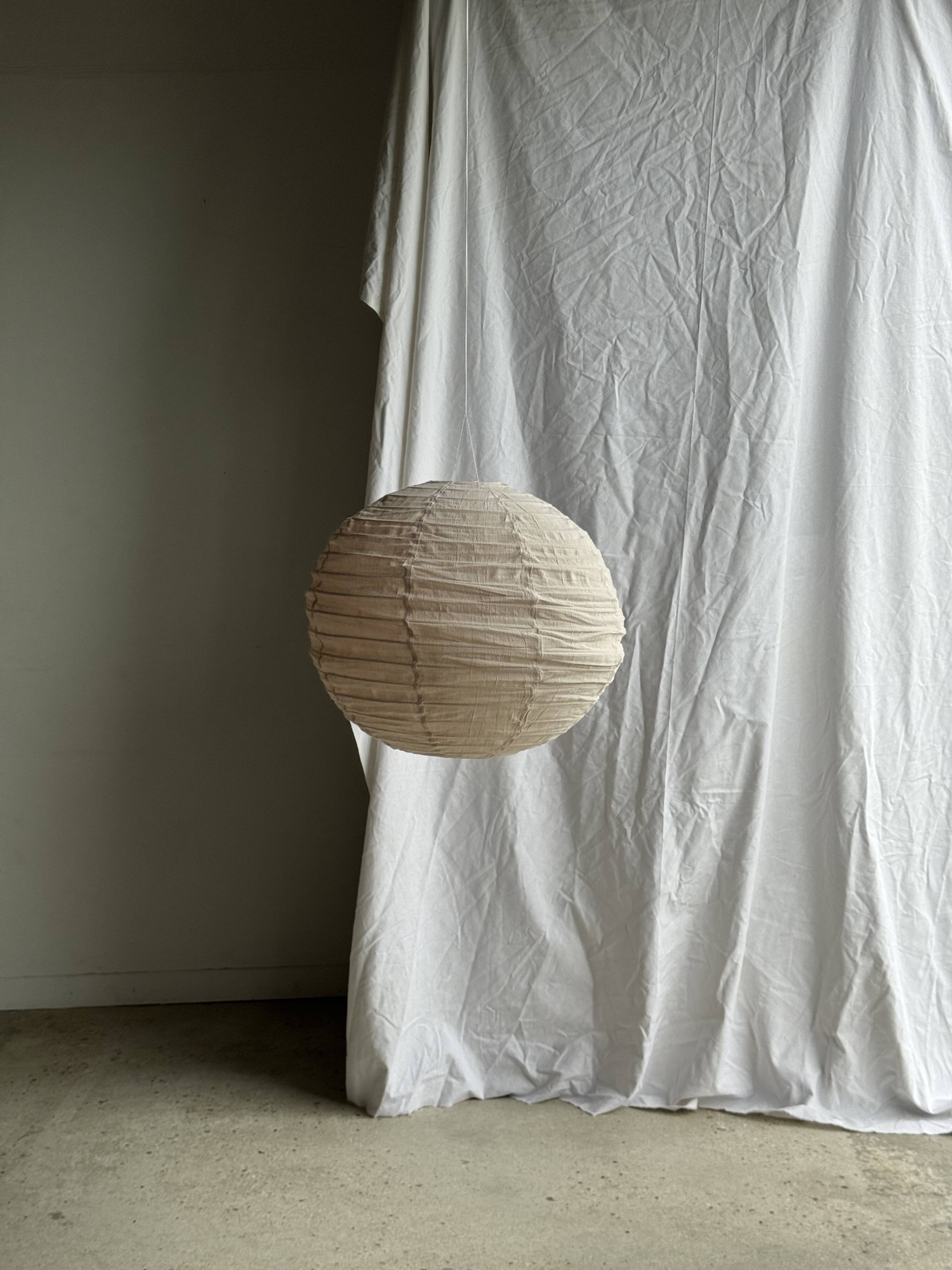 Large round pink Japanese-style suspension made of rattan and natural linen D60.