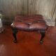 Red leather footrest in Chesterfield style, vintage 1970s.