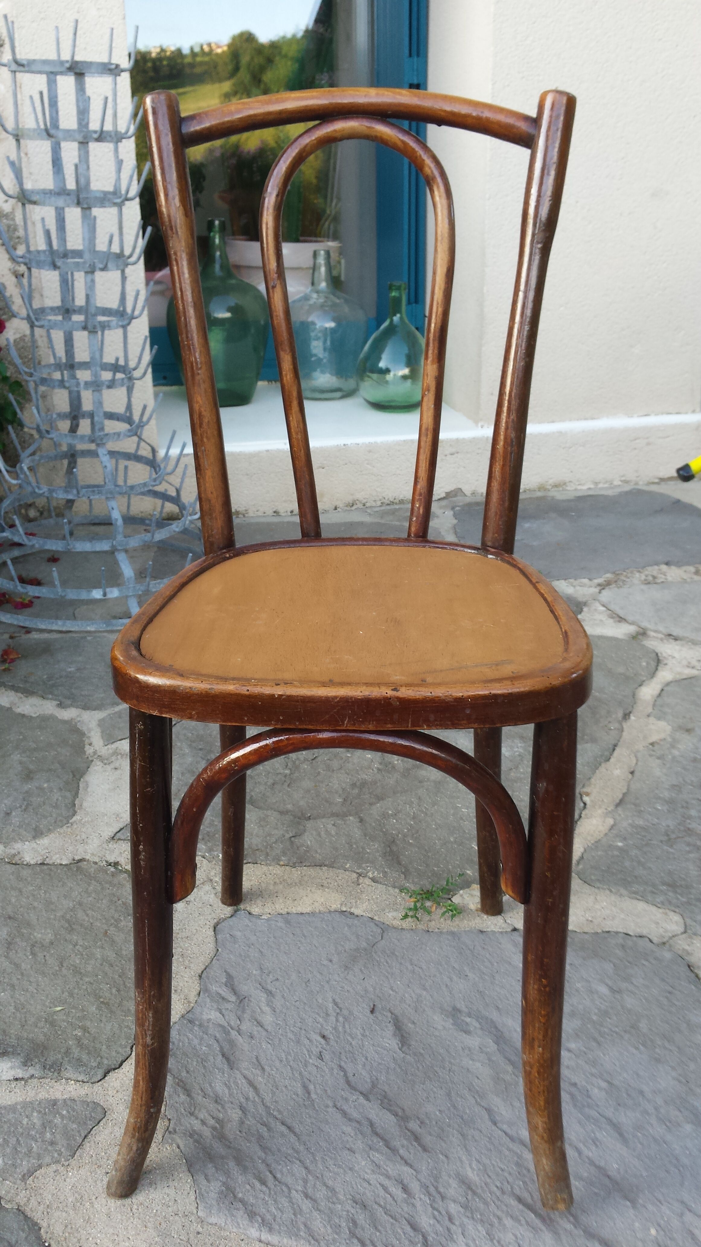 Bistro chair with buchon brand plate