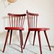 Pair of wooden bistro chairs and red imitation seating