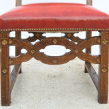 6 red leather chairs