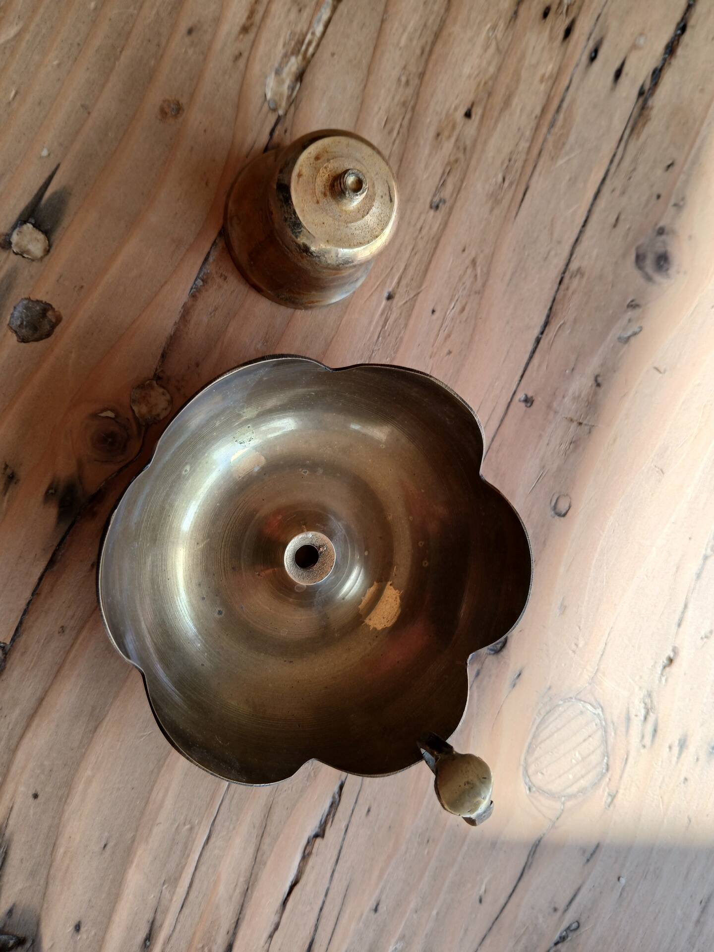 Brass candle holder in the shape of a flower.