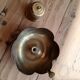 Brass candle holder in the shape of a flower.