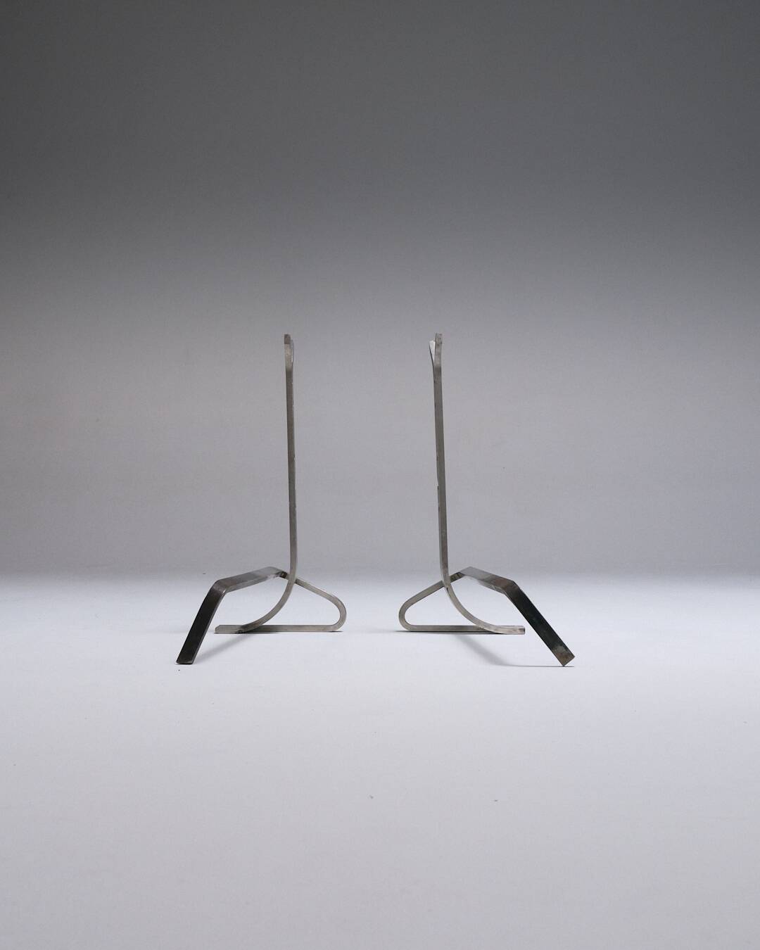 Pair of modernist brushed steel andirons, 1970s