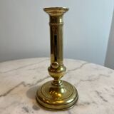 Bougeoir ancien en cuivre à bouton pressoir