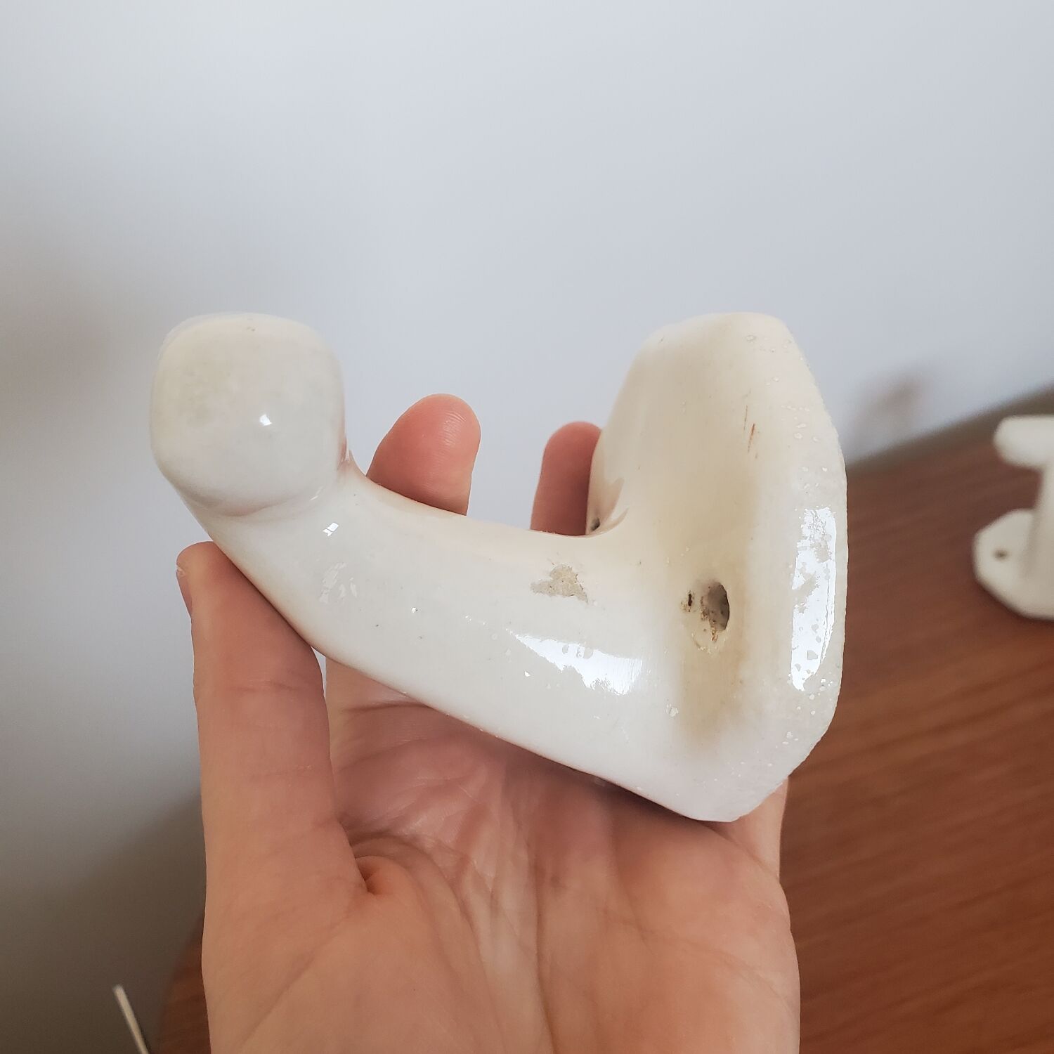 Trio of white porcelain hooks