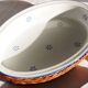 Set of 4 white porcelain dishes with blue decorations and wicker stands