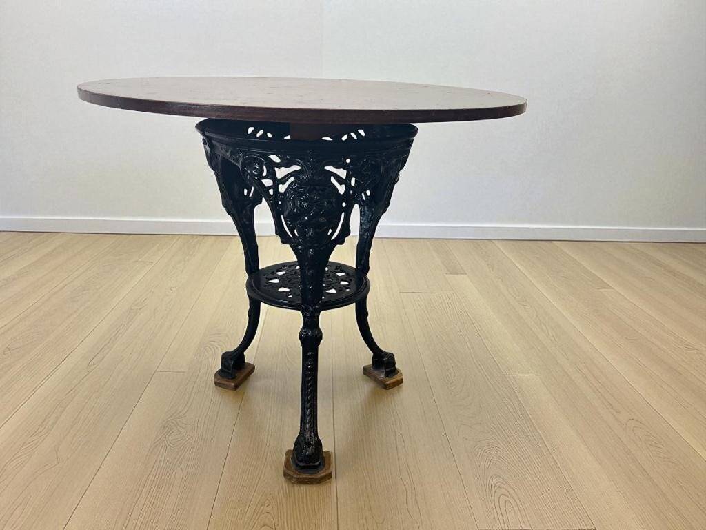 Vintage French round bistro table with cast iron frame