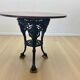 Vintage French round bistro table with cast iron frame