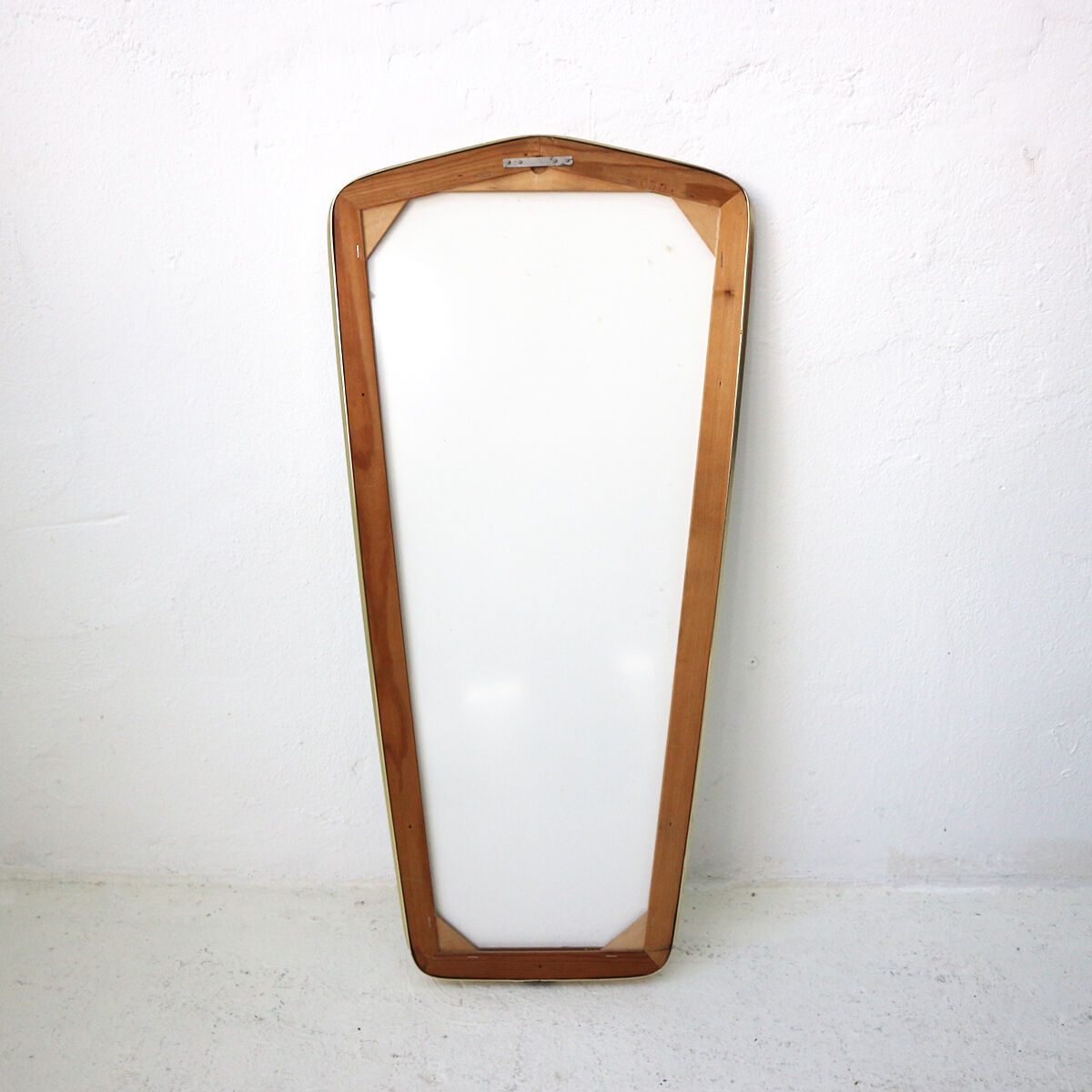 '50s wall mirror with relief brass frame