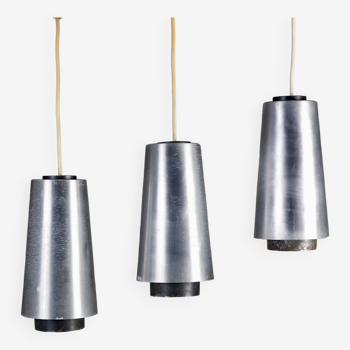 Trio of Raak steel pendant lights, 1960s