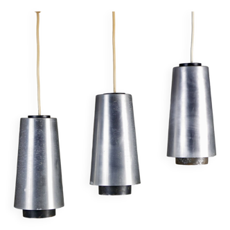 Trio of Raak steel pendant lights, 1960s