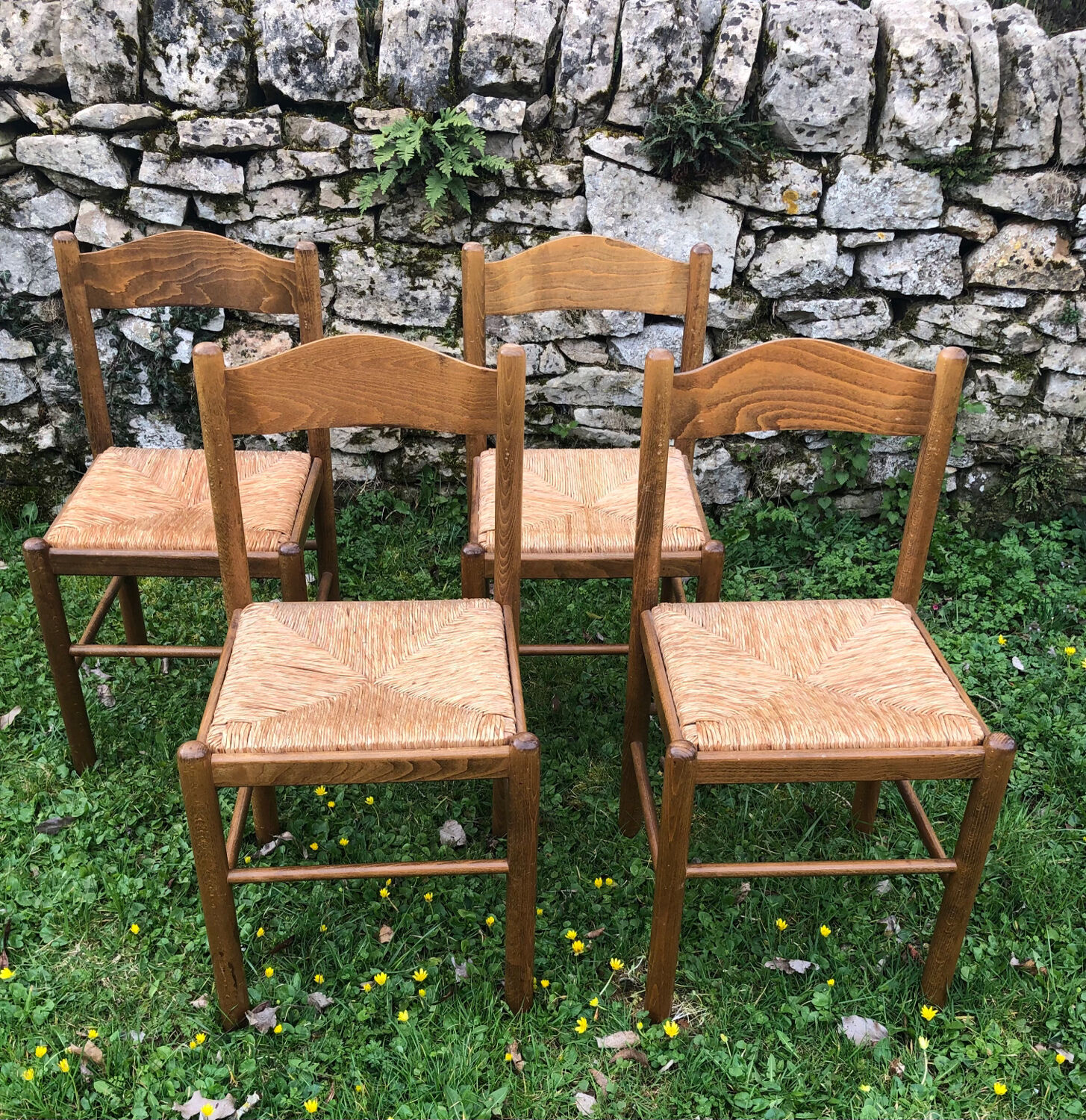 4 wood and straw chairs