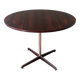 Round table in varnished rosewood