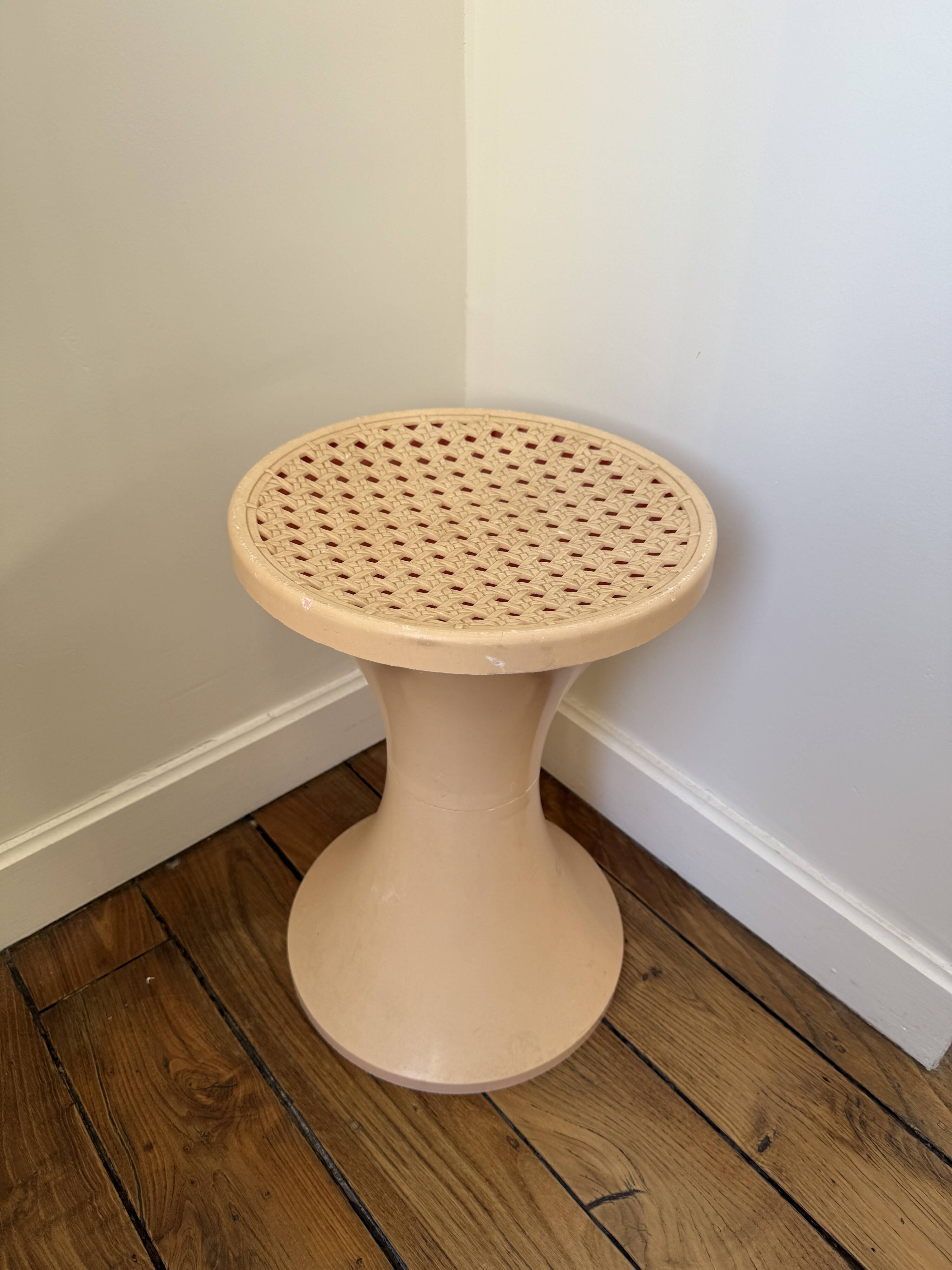 Tam Tam Stamp stool Made in France with a woven rattan-style seat.