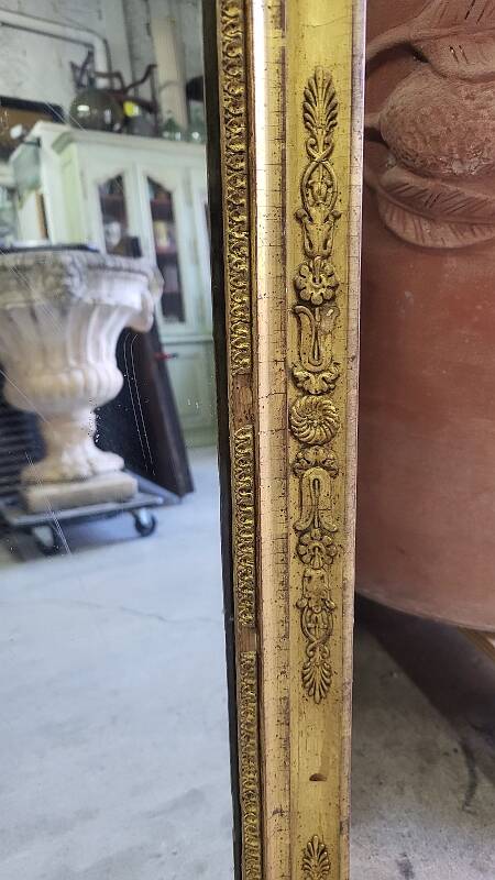 GOLDEN WOODEN MIRROR WITH PALMETTES FROM THE 19TH CENTURY