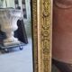 GOLDEN WOODEN MIRROR WITH PALMETTES FROM THE 19TH CENTURY