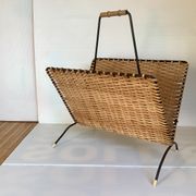 Old magazine rack in straw and black metal