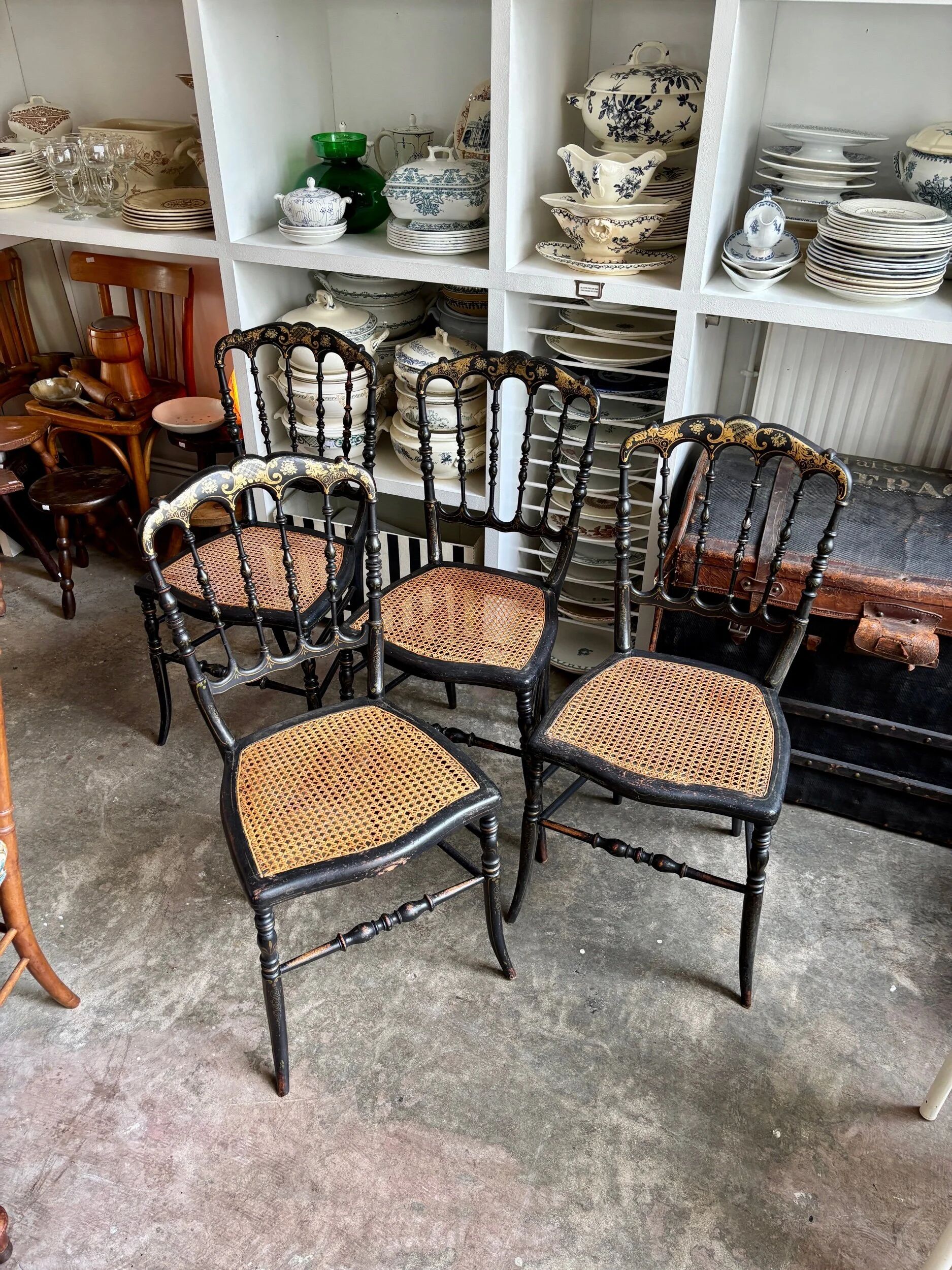 Napoleon III chair in black and gold wood with caning.