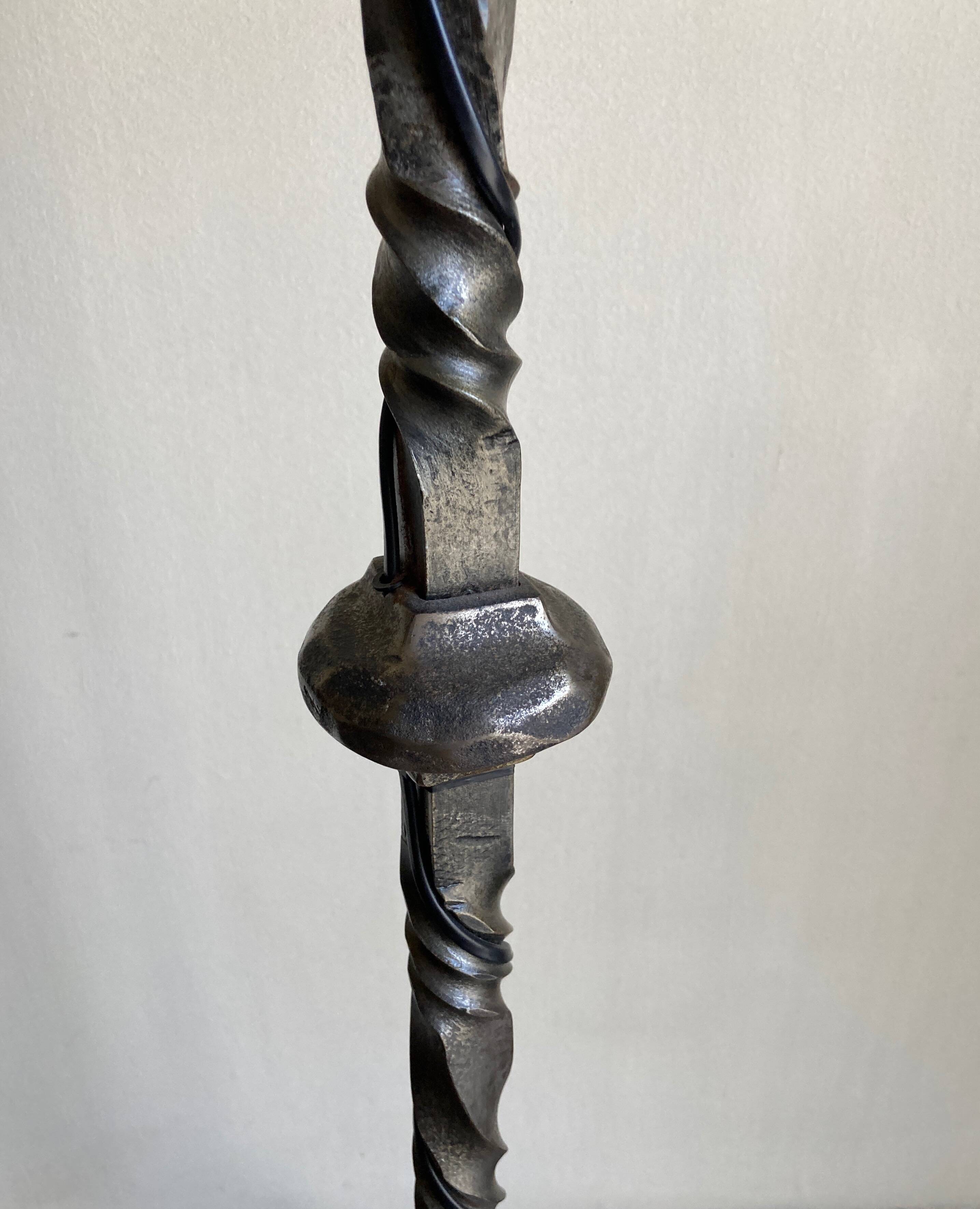 Floor lamp in beaten iron and bronze Artisans de Marolles 1960