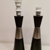 Two table lamps made of dark-stained wood with silver detail in the middle.