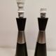 Two table lamps made of dark-stained wood with silver detail in the middle.