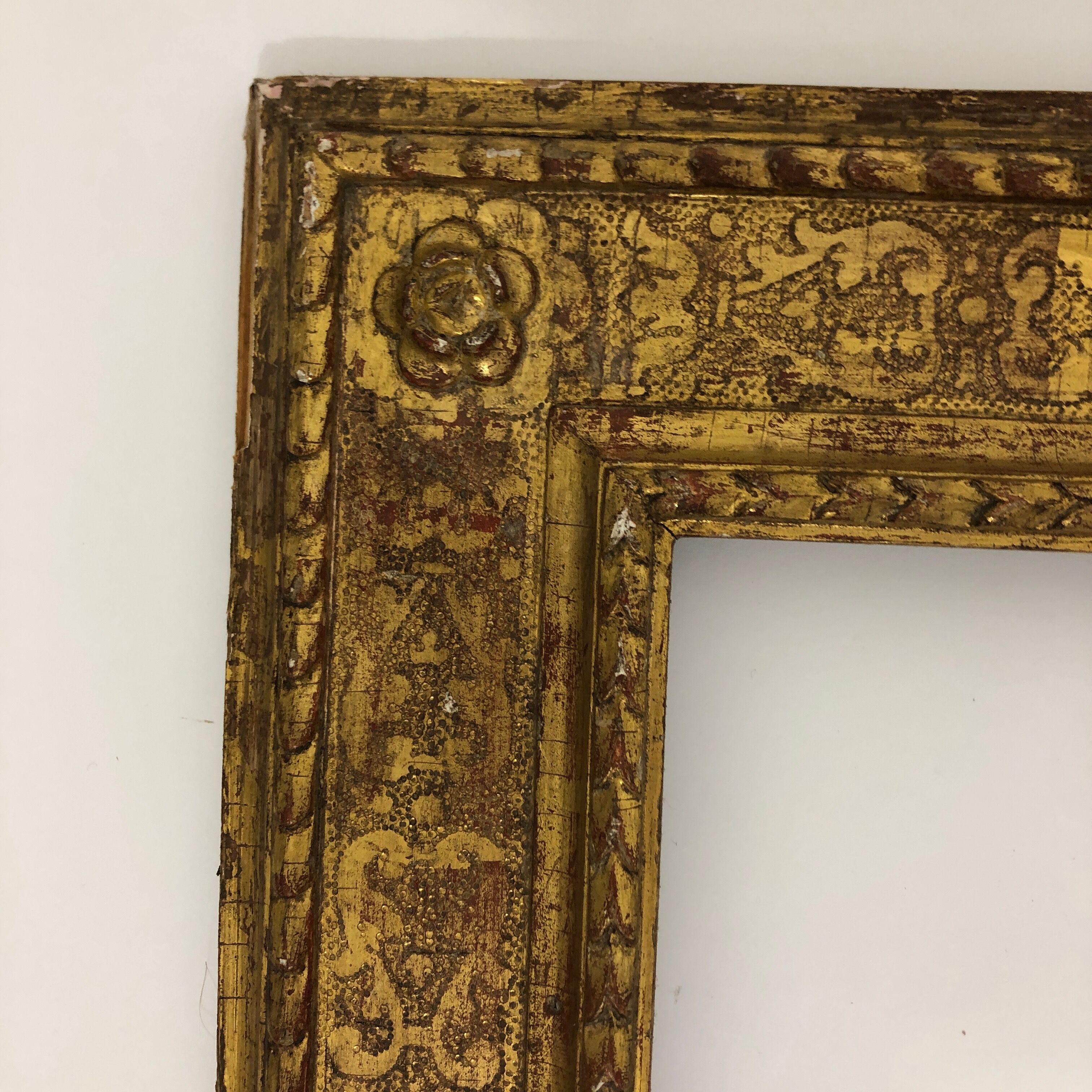 Vintage gilded frame decorated with stylized flowers
