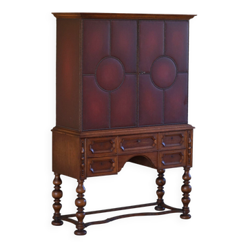 Otto Schulz, modern Swedish wardrobe in leather, oak and brass studs, 1930s.
