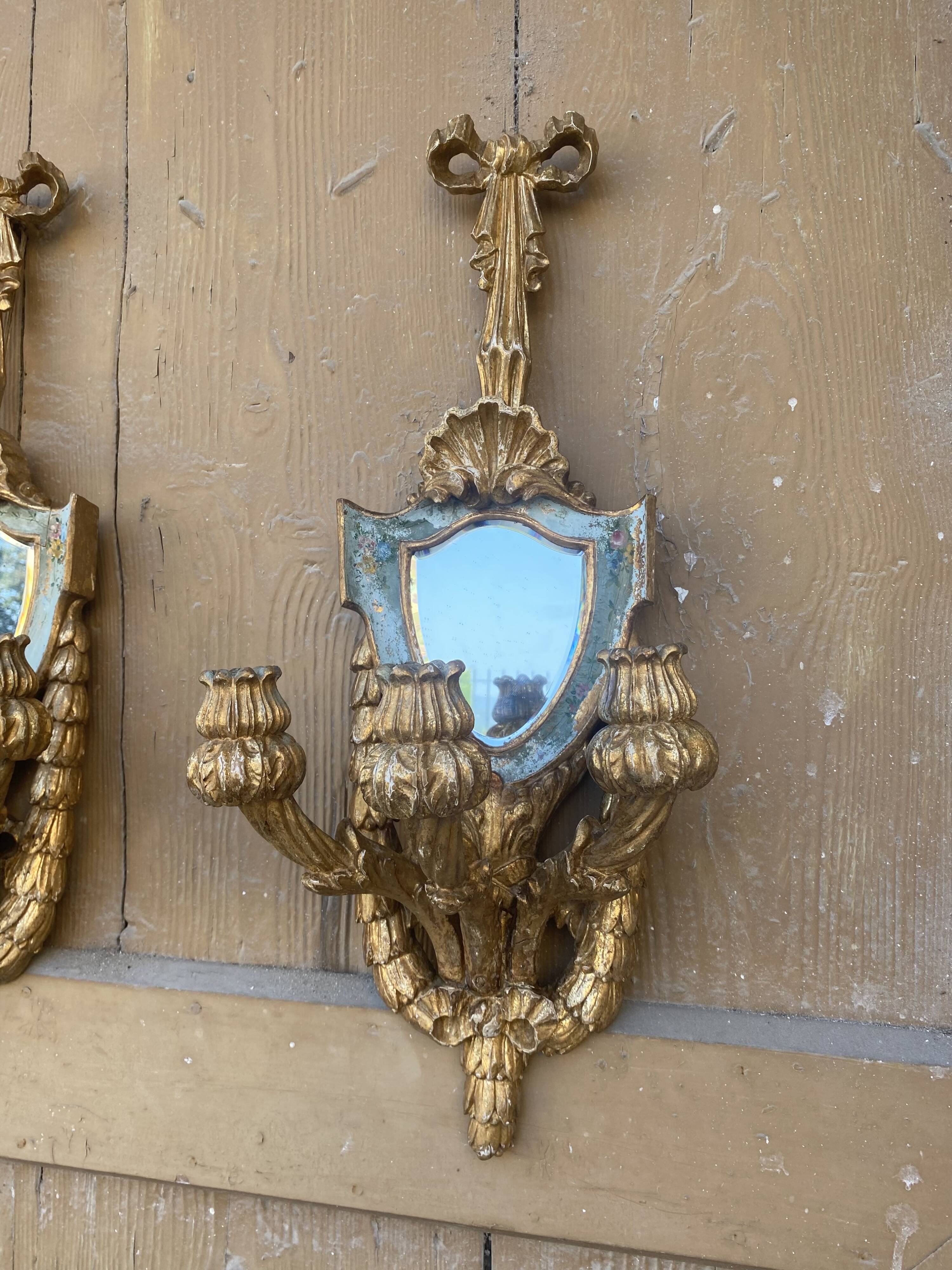 Pair of carved wood sconces