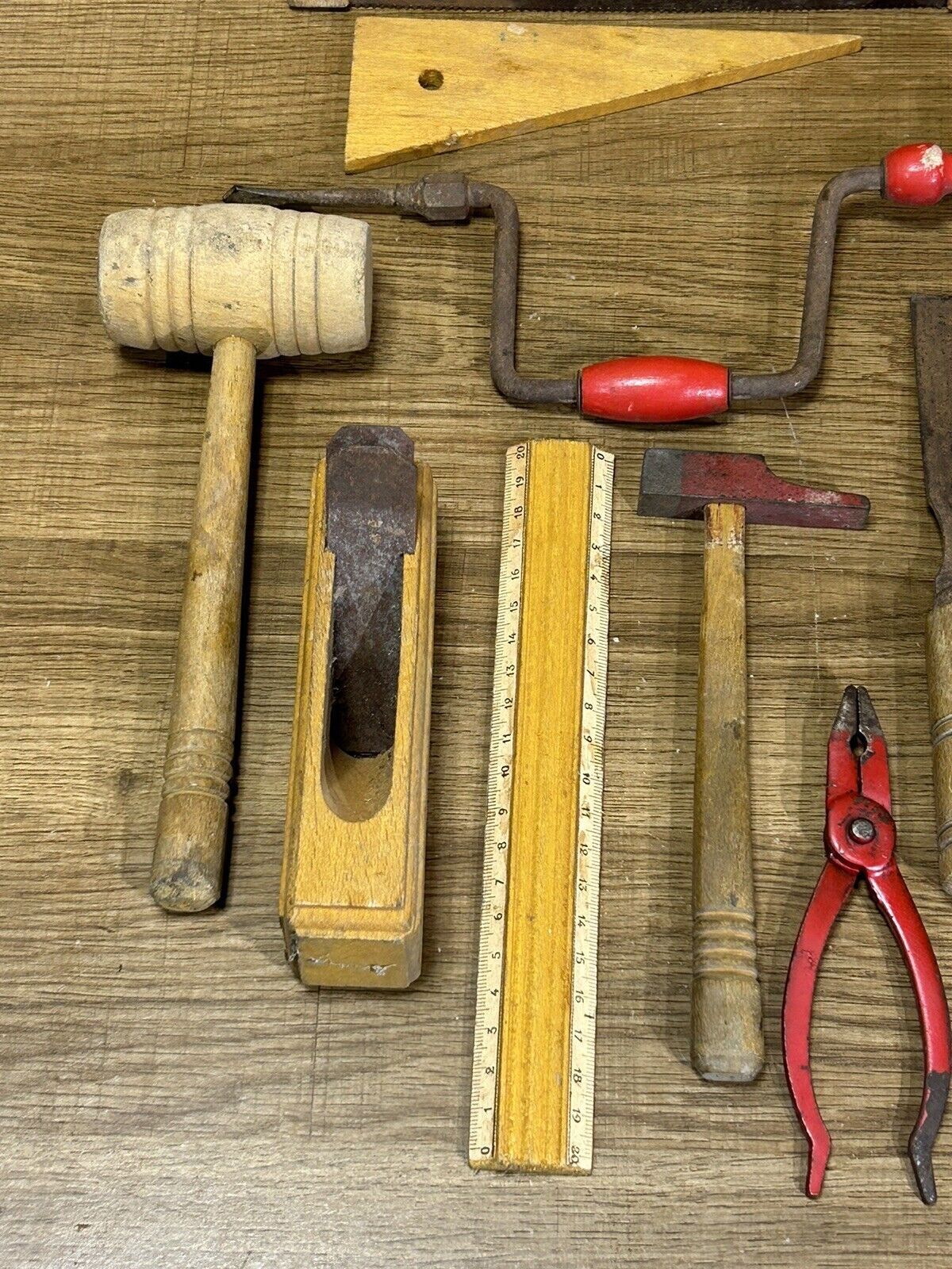 lot of antique toys, carpentry tools, wood, saw, plane, hammer,...