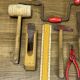 lot of antique toys, carpentry tools, wood, saw, plane, hammer,...