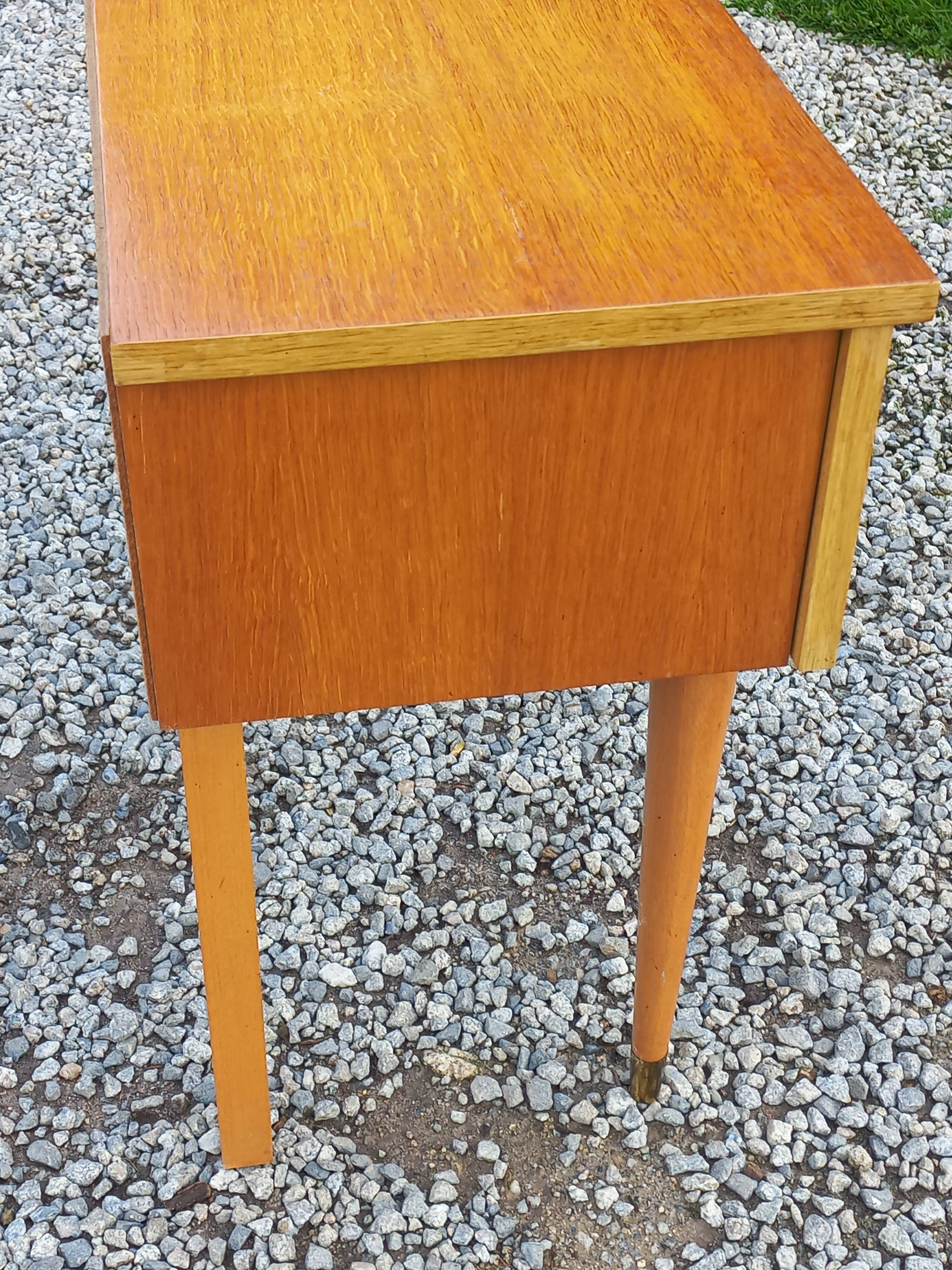Vintage 1950s bedside table in blond oak with conical legs