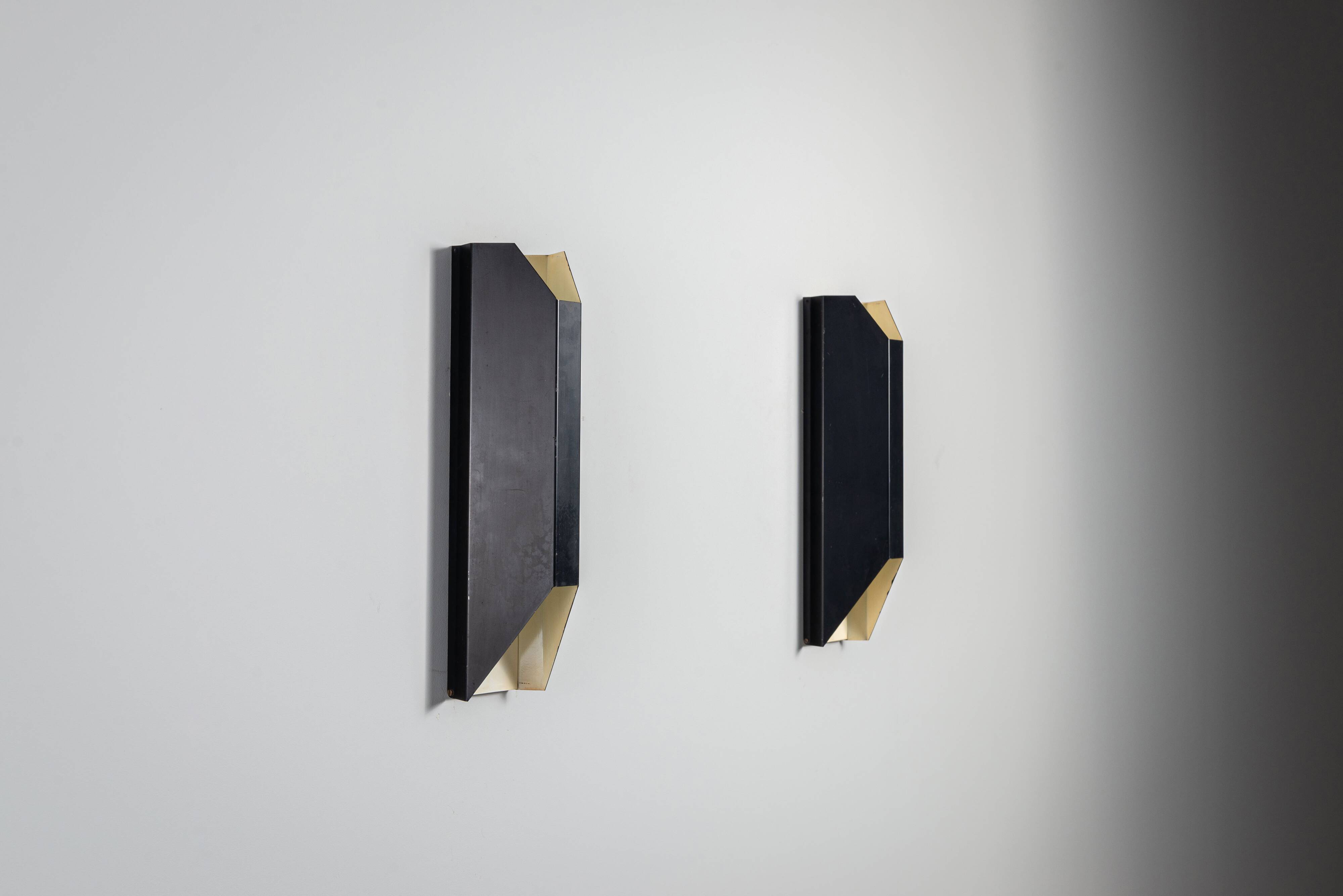 Architectural pair of vintage black metal wall lamps with angular geometric