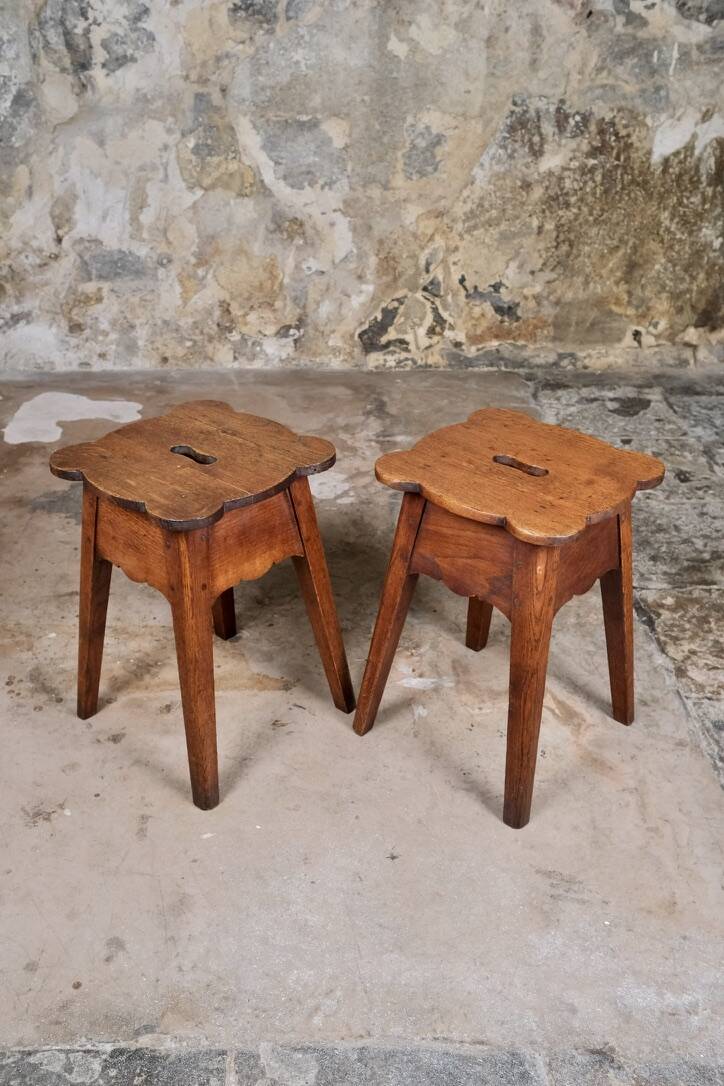Pair of scalloped oak stools, France, early 20th century