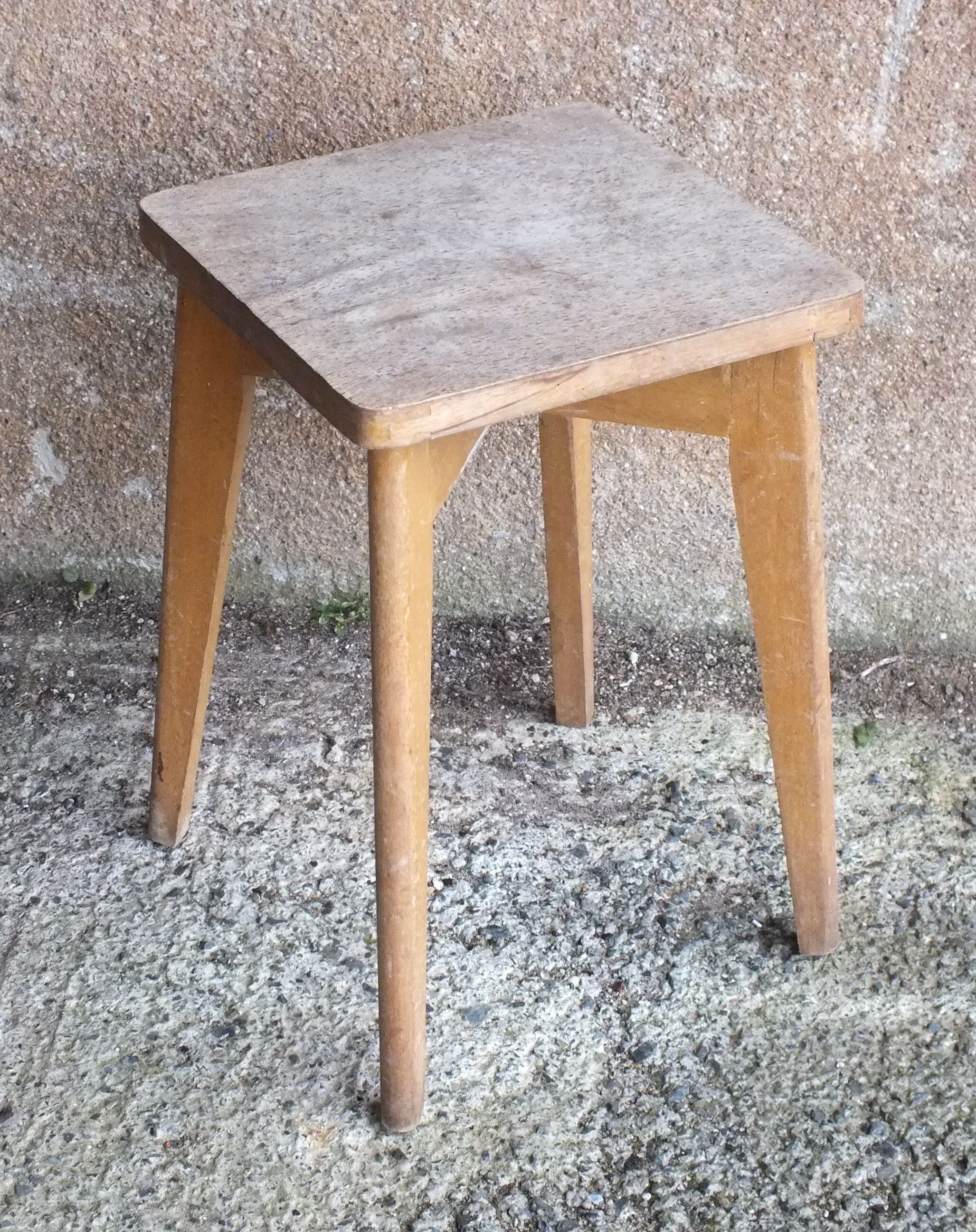 Vintage wooden stool with 4 legs from the 50s
