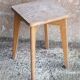 Vintage wooden stool with 4 legs from the 50s