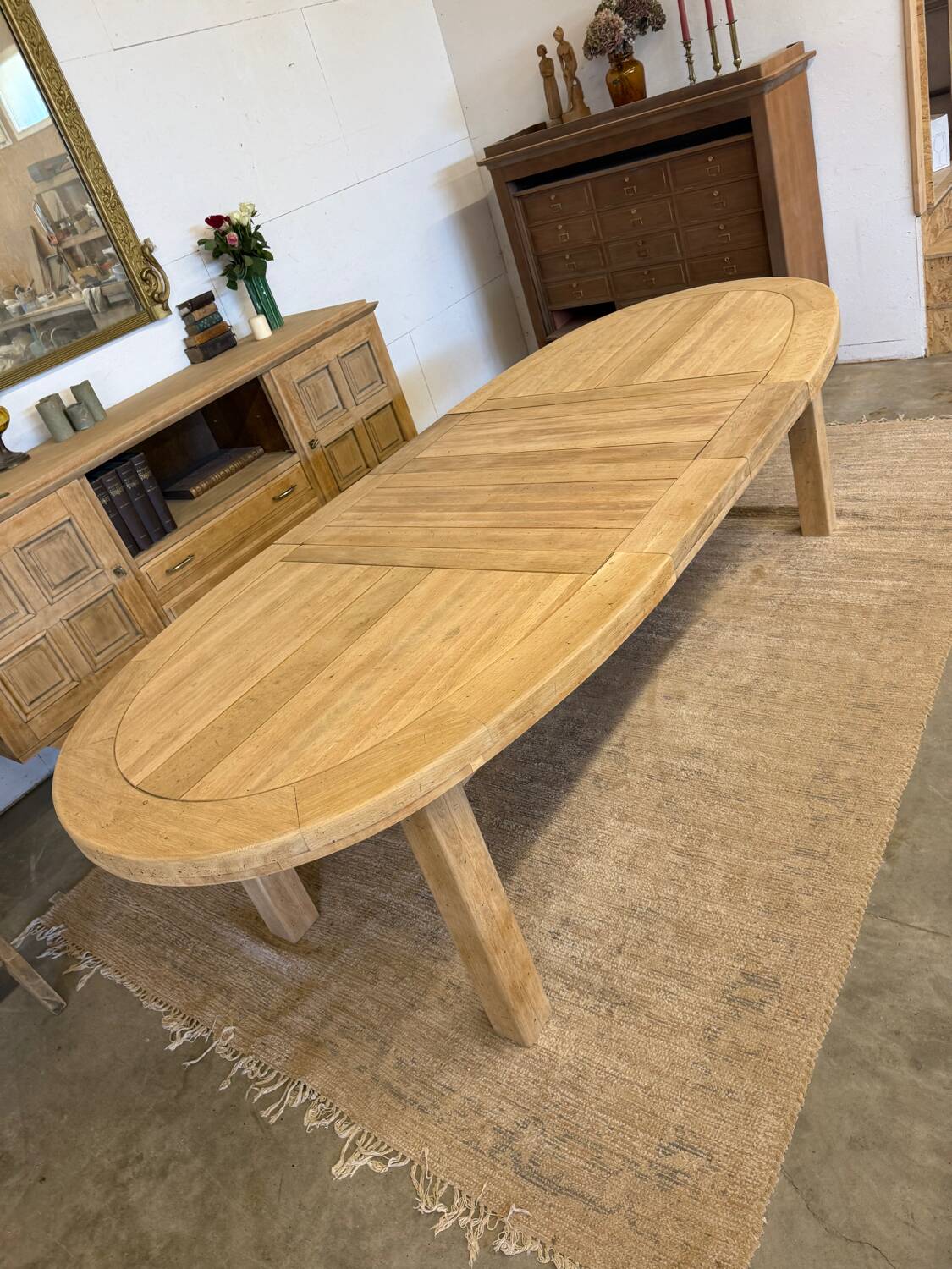 Oval farmhouse table in solid oak with extensions.