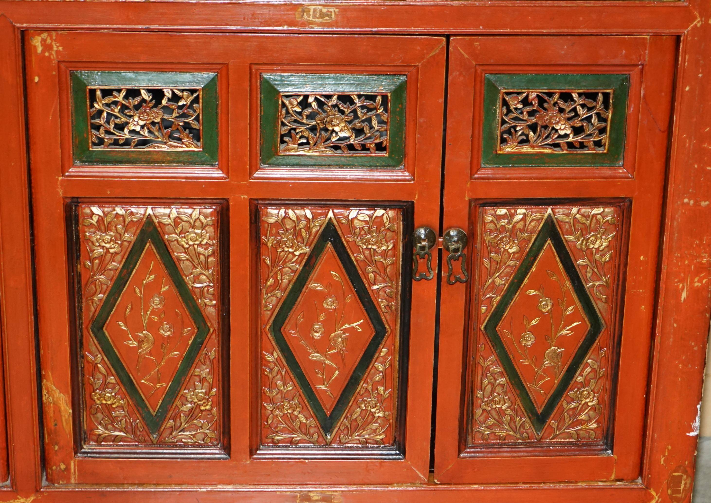 Vintage Chinese lacquered buffet decorated with gold leaf.