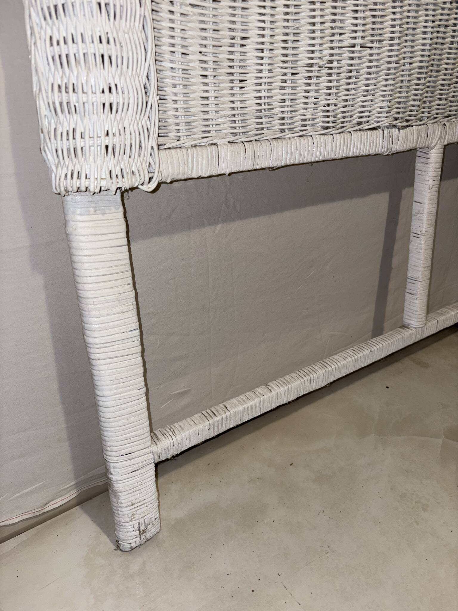 Vintage headboard in woven white rattan