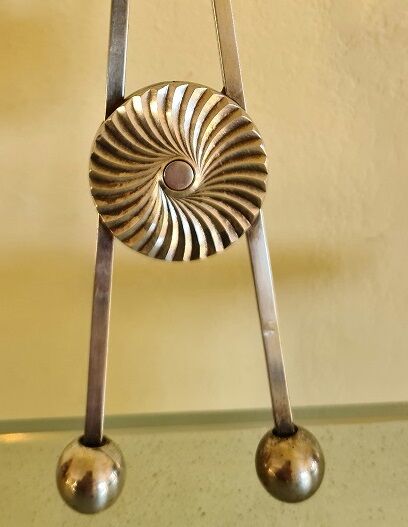 Ice cube or sugar tongs in silver metal